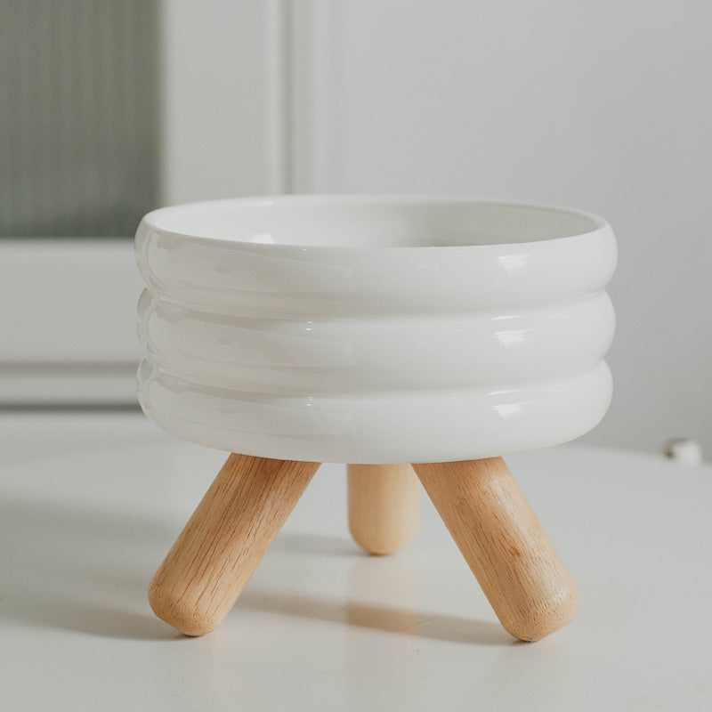 Le Tabouret: Ringed ceramic bowl on wooden legs