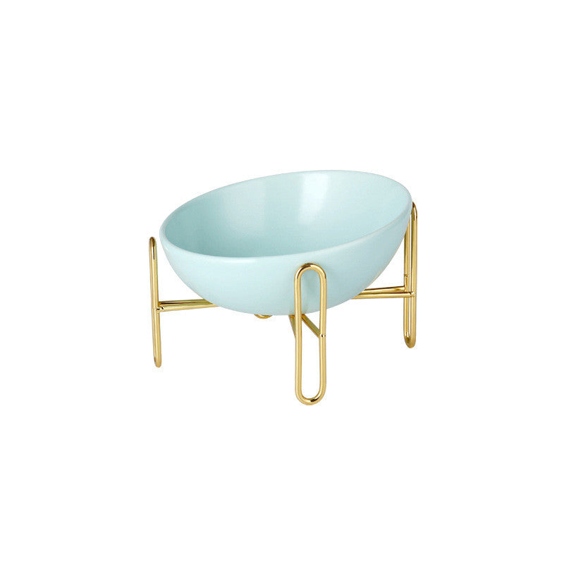 Le Trombone: Tilted ceramic bowl on a gold-tone stand
