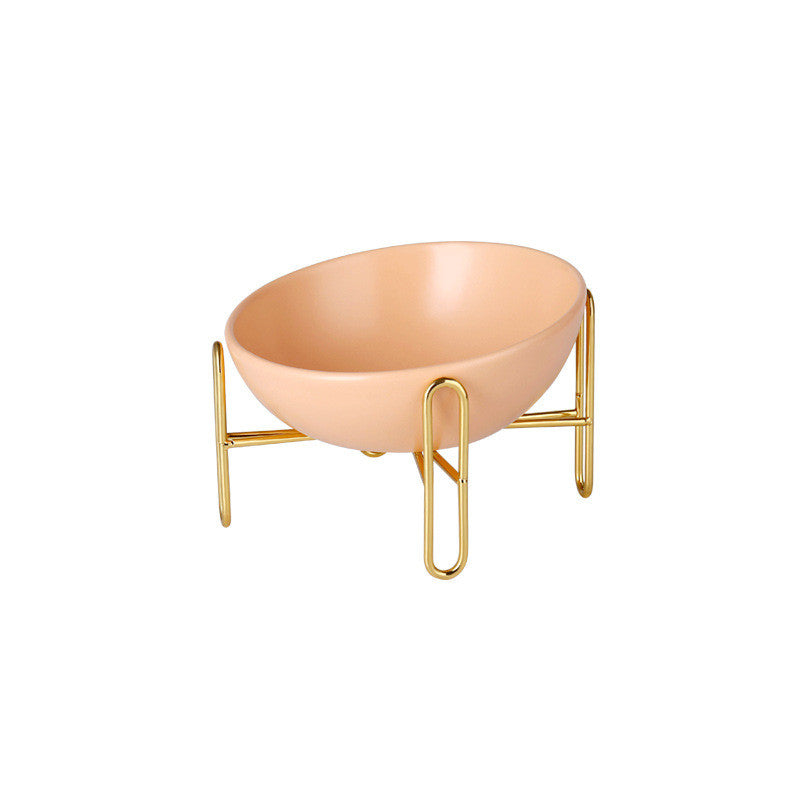 Le Trombone: Tilted ceramic bowl on a gold-tone stand
