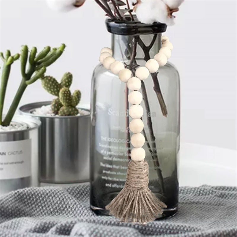 Les Trois Boucles bead loop hung on a glass vase