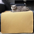 Le Canapé sisal mat draped over a sofa arm