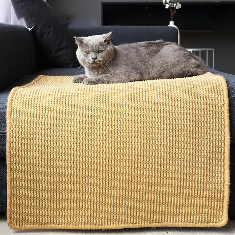 Le Canapé sisal mat draped over a sofa arm
