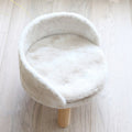 Le Pouf: Plush pet seat on wooden legs