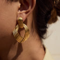 Le Ruban d'Or: Sculpted ribbon drop earrings