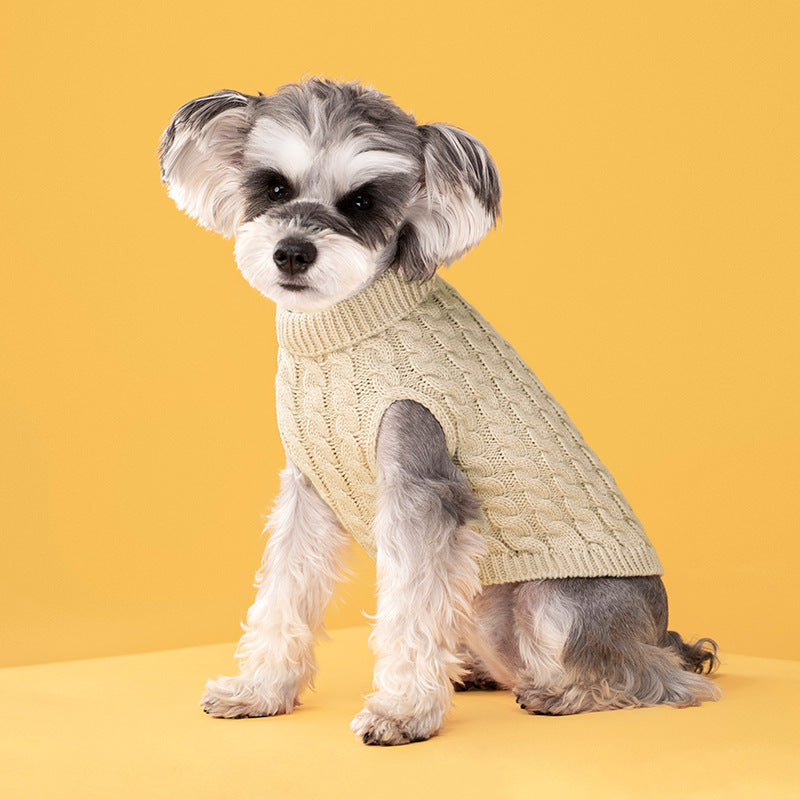 Le Tricot cable-knit sweater in oatmeal