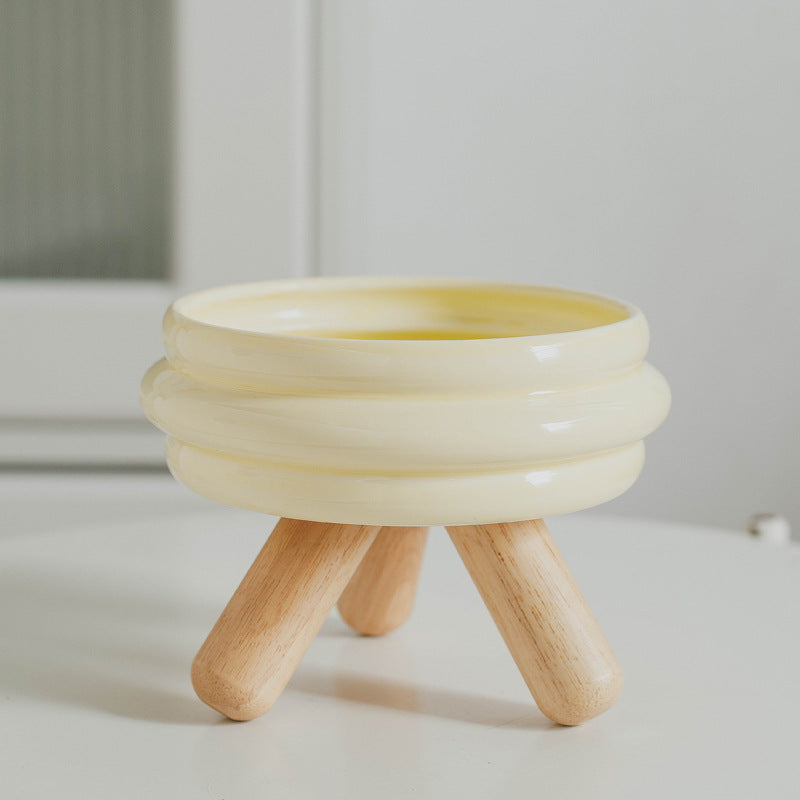 Le Tabouret: Ringed ceramic bowl on wooden legs