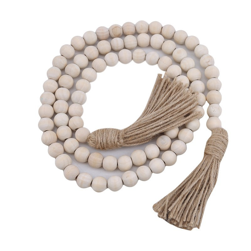 Le Chapelet: Wooden bead garland with tassels