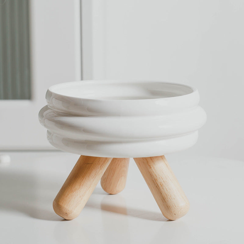 Le Tabouret: Ringed ceramic bowl on wooden legs