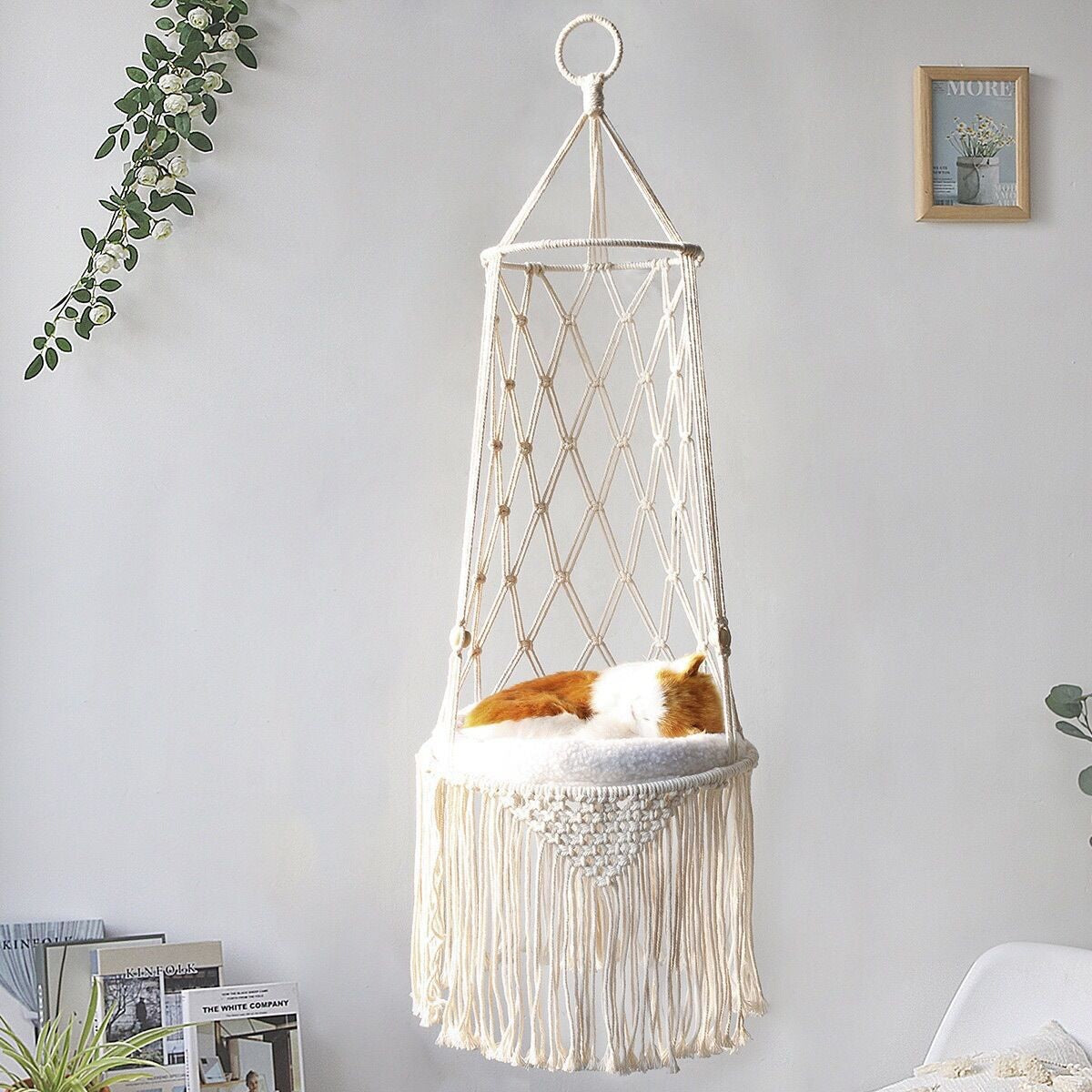 Le Hamac macramé cat hammock hanging by a window