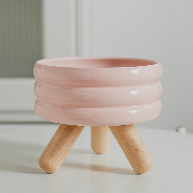 Le Tabouret: Ringed ceramic bowl on wooden legs