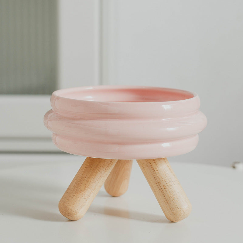 Le Tabouret: Ringed ceramic bowl on wooden legs