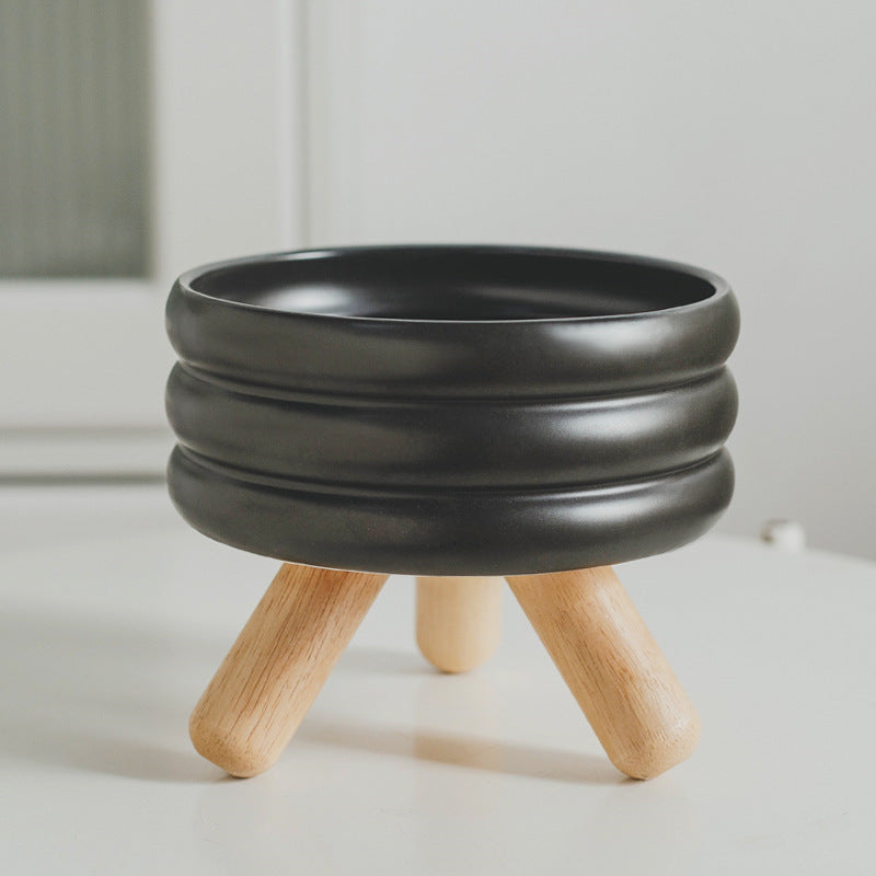 Le Tabouret: Ringed ceramic bowl on wooden legs