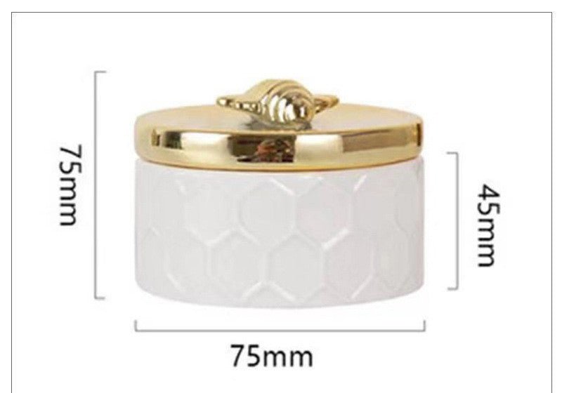 L'Abeille: White porcelain jar with gold bee lid