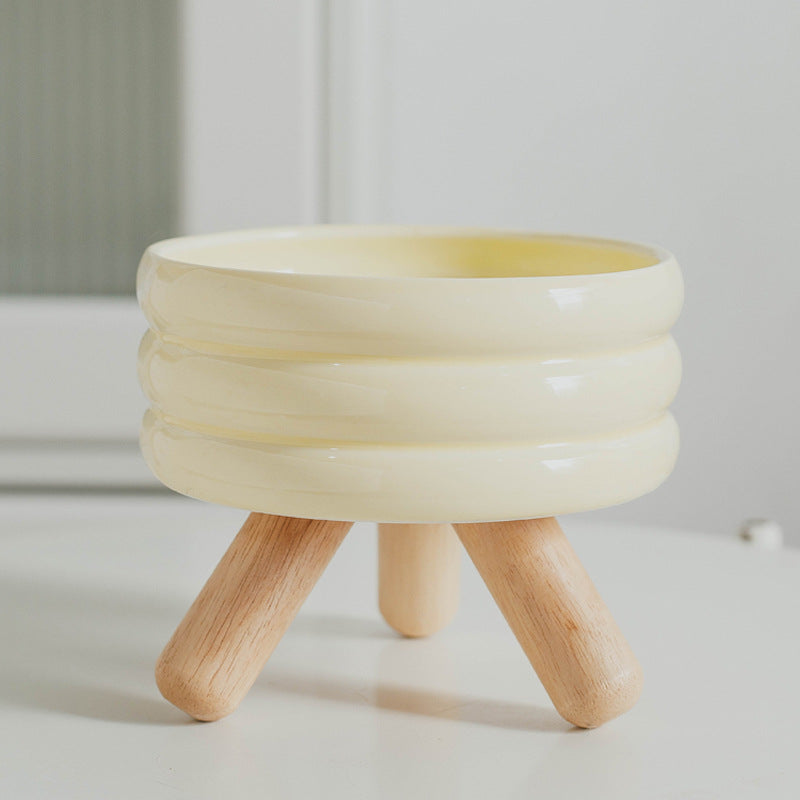 Le Tabouret: Ringed ceramic bowl on wooden legs