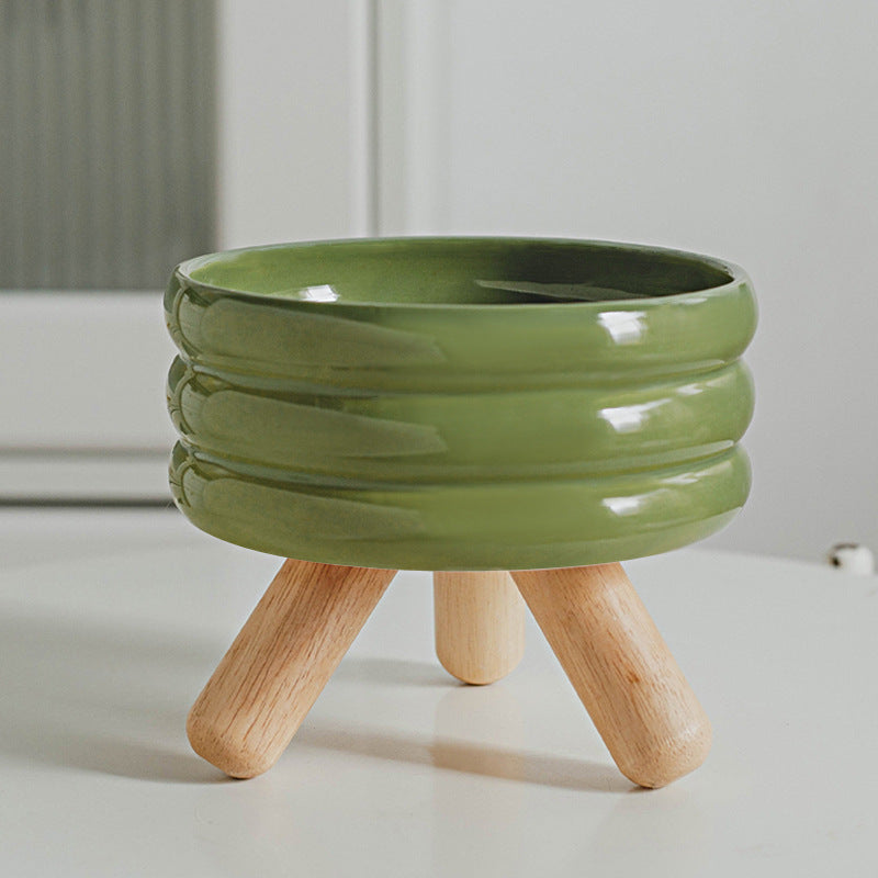 Le Tabouret: Ringed ceramic bowl on wooden legs
